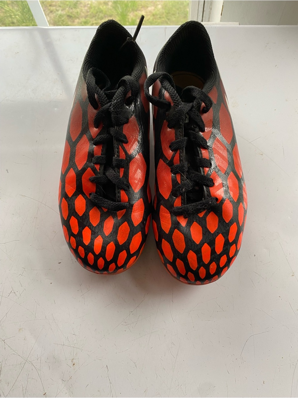 adidas Kids Black and Orange Soccer Sneakers